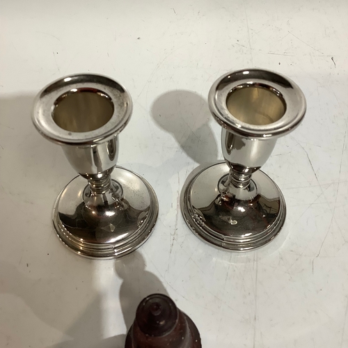 256 - Vintage cast iron candle snuffer with finger ring and a pair of silver plated candlesticks