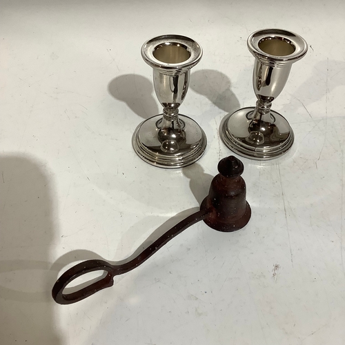 256 - Vintage cast iron candle snuffer with finger ring and a pair of silver plated candlesticks