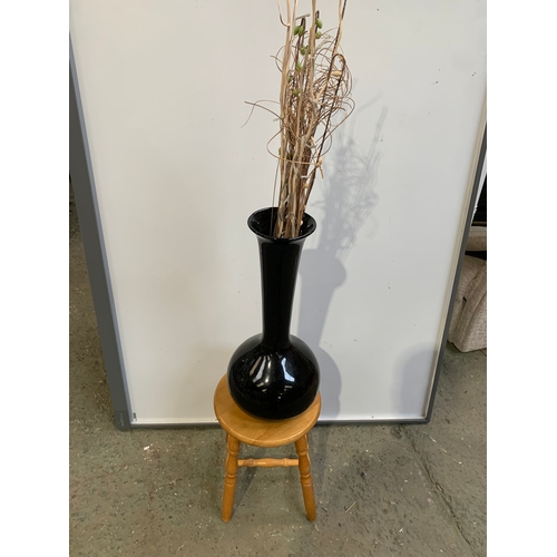 310 - Large 3ft tall black glass vase with artificial twig lights on a pine stool