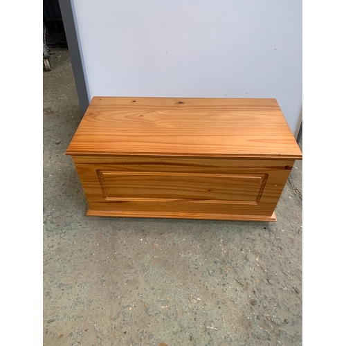 324 - Julian Bowen pine lift up chest - 90cm wide