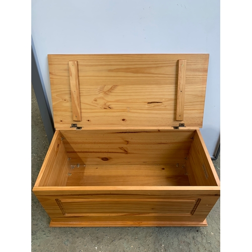 324 - Julian Bowen pine lift up chest - 90cm wide