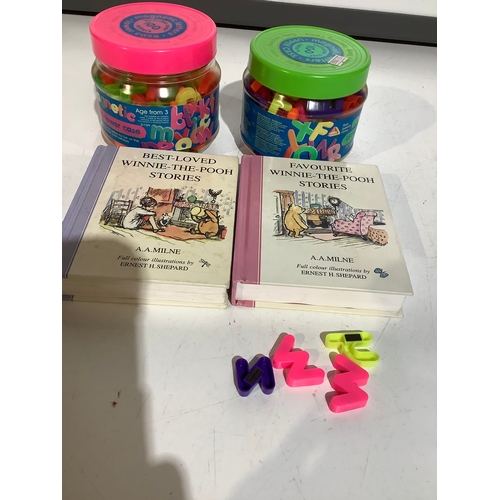 345 - 2 winnie Pooh story books + 2 tubs of magnetic letters