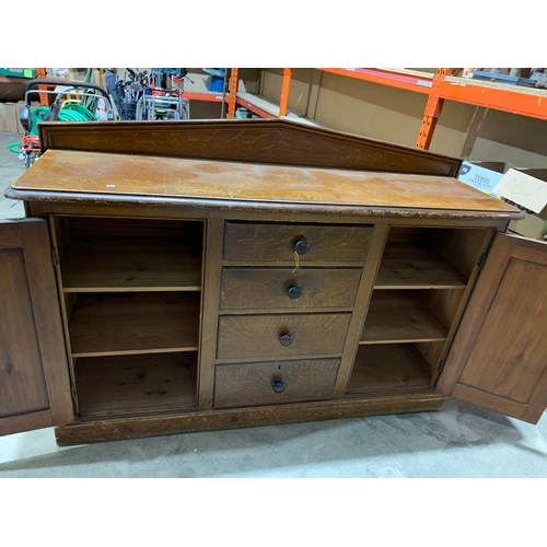 437 - Vintage Sideboard with two doors either side and four drawers in the centre. Two shelves inside both... 