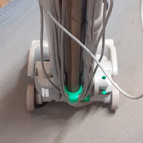 24 - Dyson DC04 vacuum. Silver with green trim. Overall pretty clean, good condition and fully working