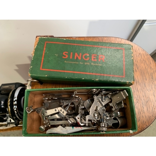 243 - Vintage Singer oak frame sewing machine with key