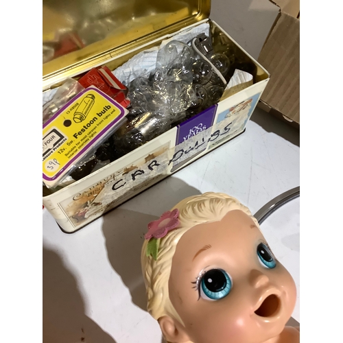 565 - Mixedlot dolls plug tin full of car bulbs plus more