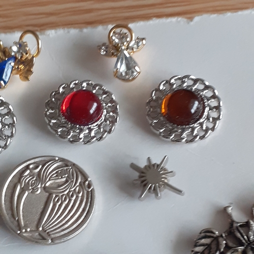 105A - A collection of Pin badges and Brooches. Eye-catching stones and designs in good condition.