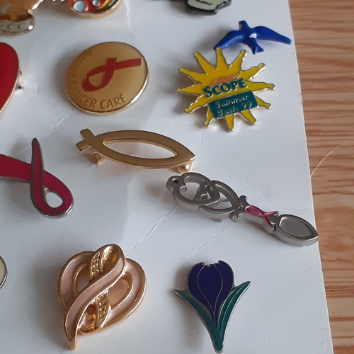 440 - A quantity of vintage and more modern, charity pin badges. Various designs from animals/cartoon type... 