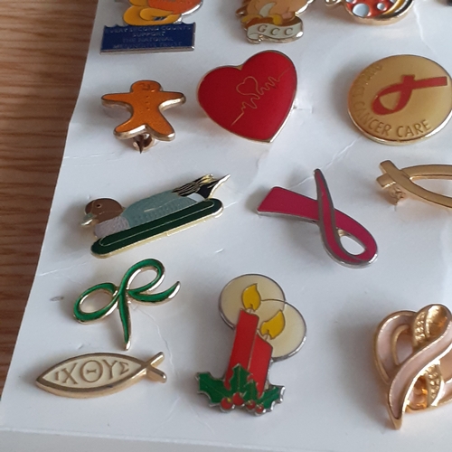 440 - A quantity of vintage and more modern, charity pin badges. Various designs from animals/cartoon type... 