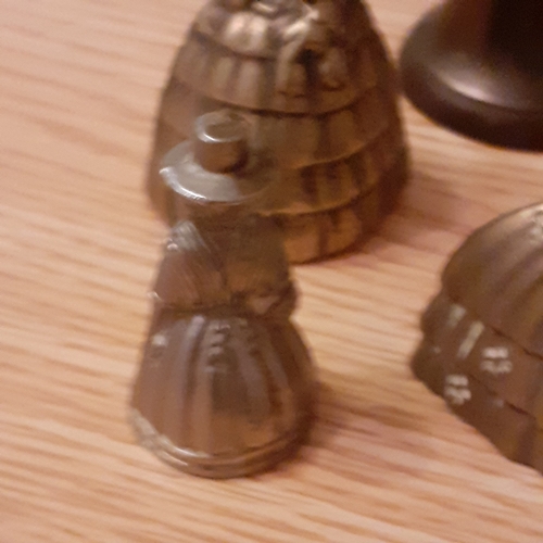 118A - A collection of Brass Bells with a Ship and some Dutch Figures. Approx 827g combined weight and all ... 