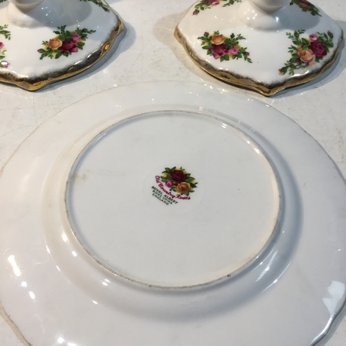 136 - Royal Albert Old Country Roses. Collection of Three Vases, Side Plate and Pair of Candle Holders