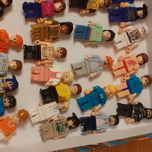 447 - Large quantity of minifigures. Lots undamaged and complete, shown in box on picture, plus a bag  of ... 