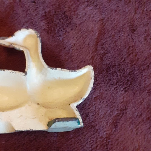 136A - Cast Iron Doorstop in family of ducks design. Solid piece, some wear but still attractive