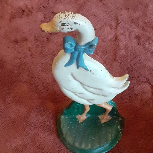 118B - Cast Iron Doorstop in duck design. Solid piece, some wear but still attractive