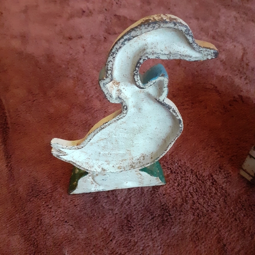 118B - Cast Iron Doorstop in duck design. Solid piece, some wear but still attractive