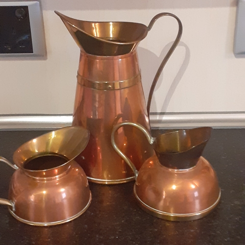 132A - 3 x Copper and Brass Pitchers/Jugs. Overall nice condition with the exception of one small dent in o... 