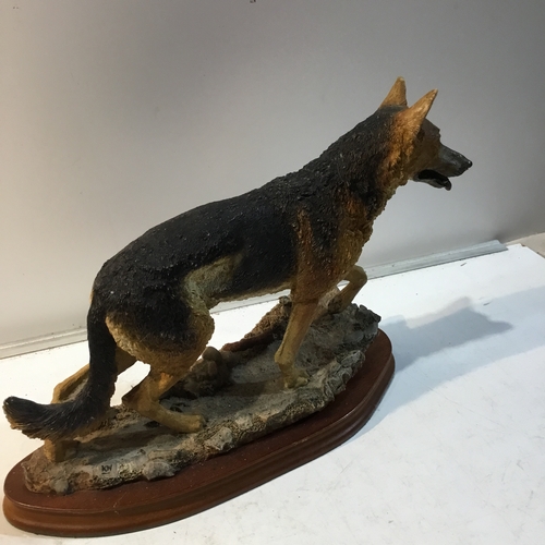 205 - Caithness Scotland natural world dog figure on wooden plinth