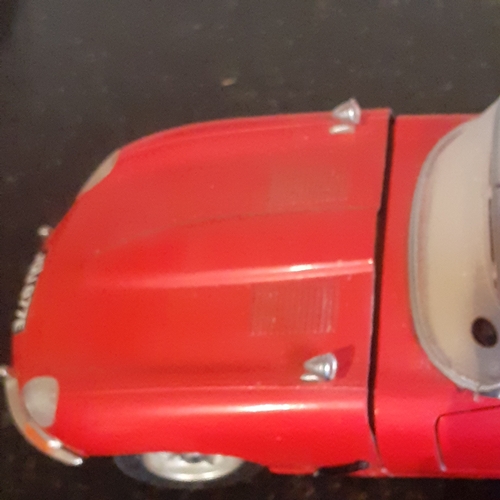 112B - Diecast Burago Jaguar 'E' type and a Jaguar XK180 by Welly. Playworn condition but no major damage w... 