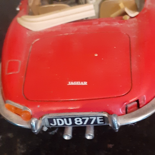 112B - Diecast Burago Jaguar 'E' type and a Jaguar XK180 by Welly. Playworn condition but no major damage w... 