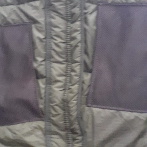 423 - Good quality green military/fishing sleeping bag. Quilted, netting pockets and a hood. Has ties for ... 