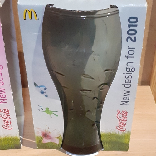 139A - 2 x collectible 2010 Macdonalds Coca-Cola glasses. Original packaging. Green hint and pink. Unopened... 