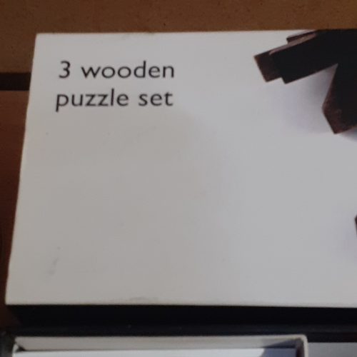 425 - New in box John Lewis wooden puzzles. Has instructions and solutions. Take apart, shuffle and spend ... 