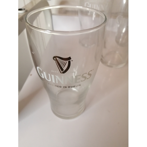 42A - Collection of 8 Guinness pint glasses and a Guinness glass tankard