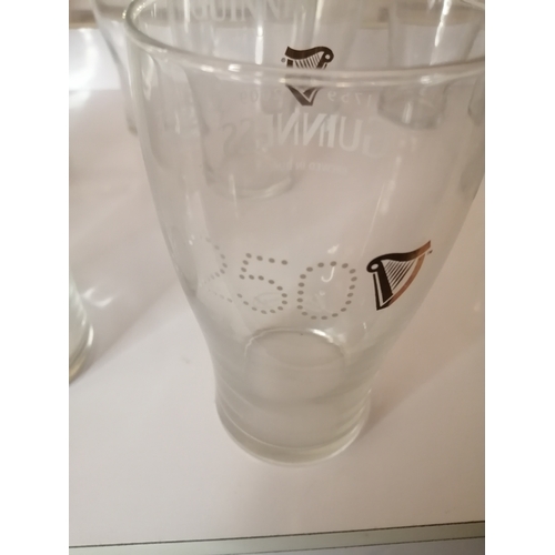 42A - Collection of 8 Guinness pint glasses and a Guinness glass tankard