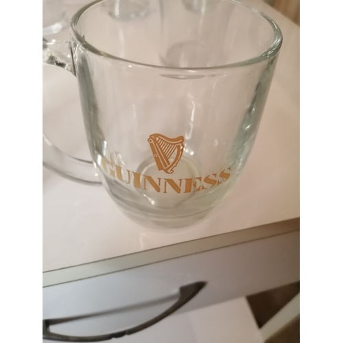 42A - Collection of 8 Guinness pint glasses and a Guinness glass tankard