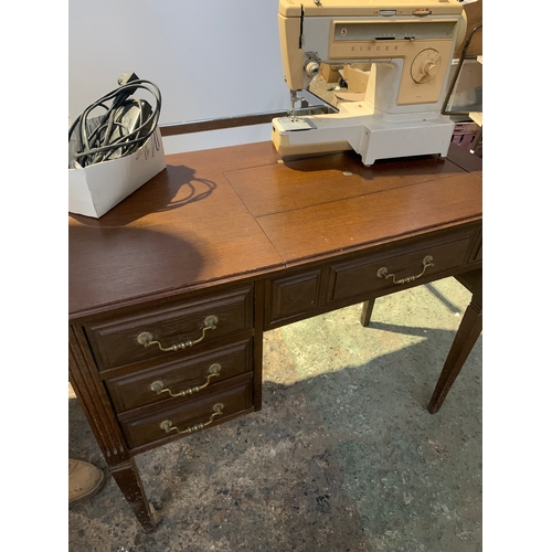 961 - Singer sewing machine with original wooden table