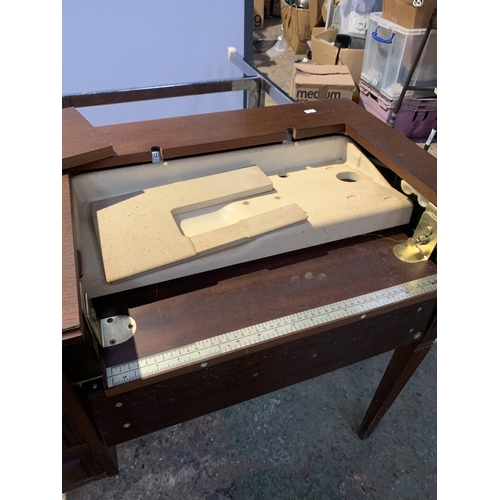 961 - Singer sewing machine with original wooden table