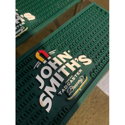 966 - Trio of John Smiths silicone beer mats