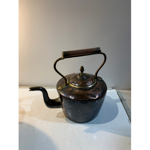 241 - Large copper kettle with brass handle