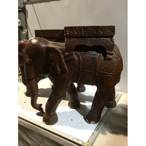 249 - Pair of matching wooden elephant stands - approx 50cm wide - good condition