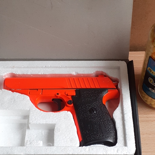 429 - G.3 airsoft pistol with an unopened jar of pellets.