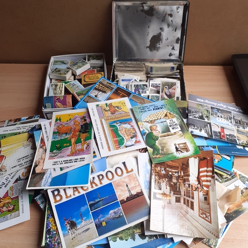 434 - Quantity of collectible postcards, cigarette cards and matchboxes. Includes some postcards which are... 