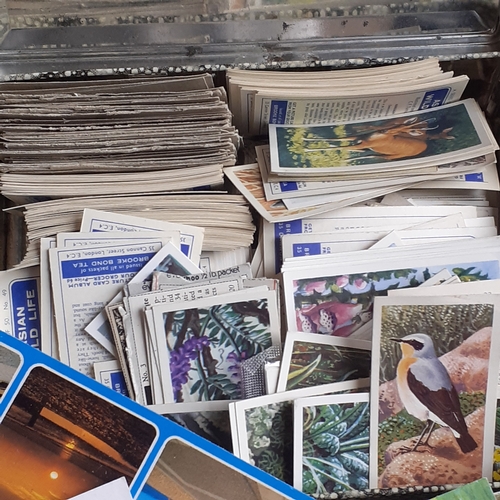 434 - Quantity of collectible postcards, cigarette cards and matchboxes. Includes some postcards which are... 