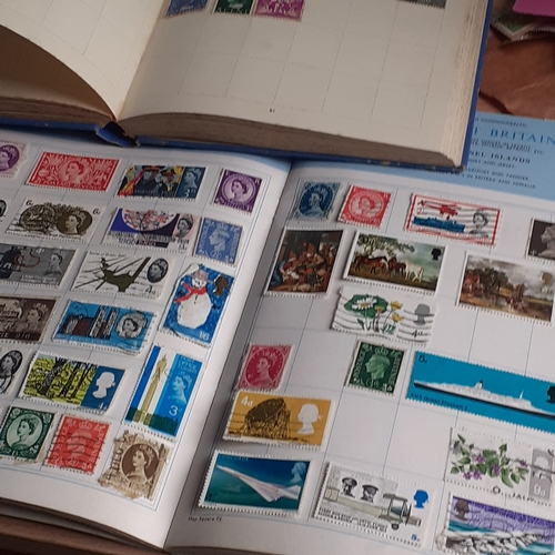 430 - 4 x part filled stamp albums and some loose stamps. Various worldwide countries throughout