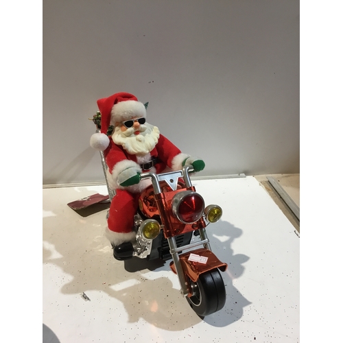 144 - Santa on motorbike sounds & singing battery operated working with added remote switch