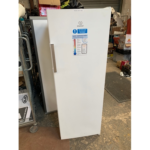 196 - Indesit tall standing fridge - working order - corrosion to the edges