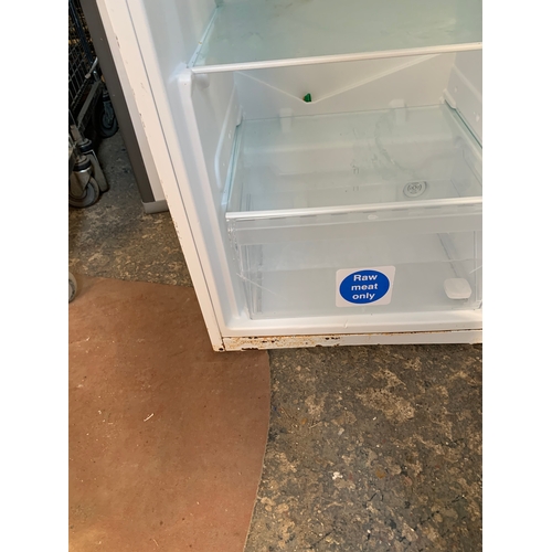 196 - Indesit tall standing fridge - working order - corrosion to the edges