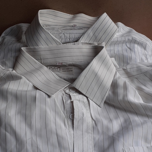 15 - A quantity of mens shirts some of which are 100% pure silk from Hong Kong. Some look unworn and some... 