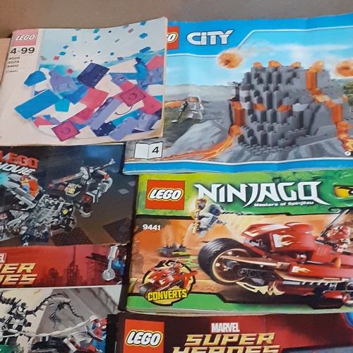 11 - A quantity of Lego instruction booklets, including Marvel Super Heroes. City, Speed etc