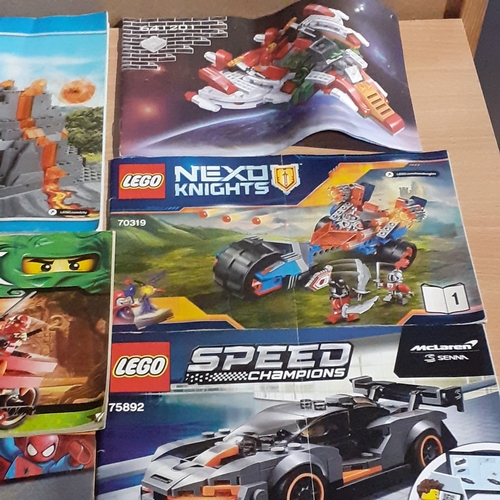 11 - A quantity of Lego instruction booklets, including Marvel Super Heroes. City, Speed etc