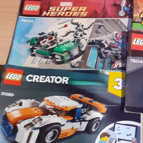 11 - A quantity of Lego instruction booklets, including Marvel Super Heroes. City, Speed etc