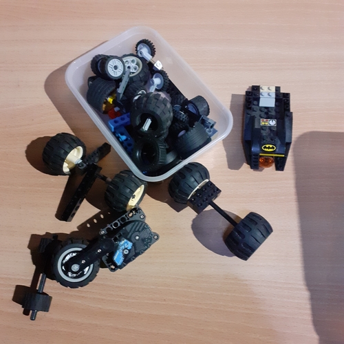 6 - Spare Lego wheels and axels etc with a part built batmobile. Pieces shown in pictures