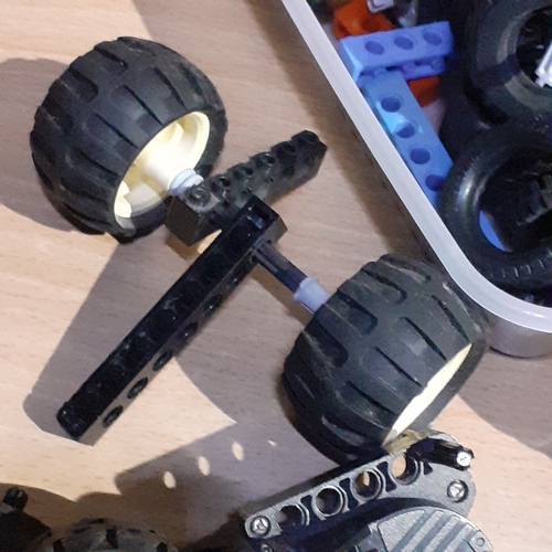 6 - Spare Lego wheels and axels etc with a part built batmobile. Pieces shown in pictures