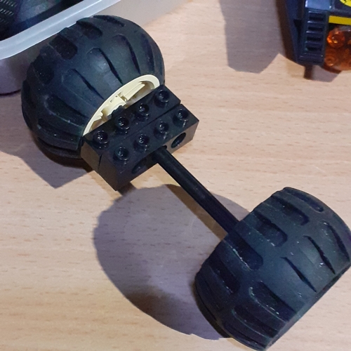 6 - Spare Lego wheels and axels etc with a part built batmobile. Pieces shown in pictures