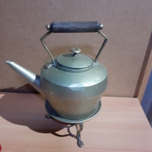 18 - Metal teapot on stand. Shows makers marks on base so possibly silver plate. Wooden handle. Some age ... 