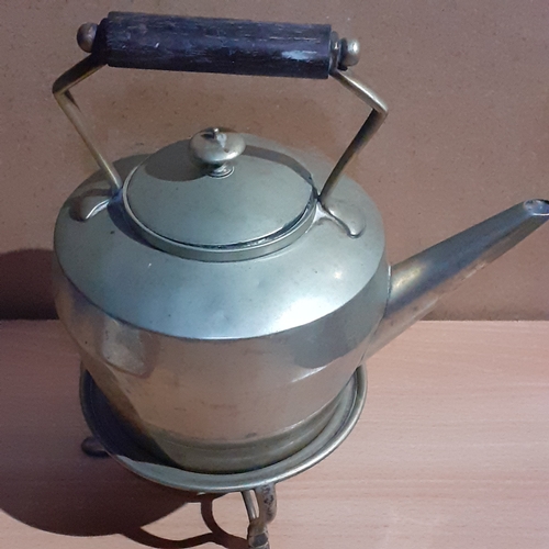 18 - Metal teapot on stand. Shows makers marks on base so possibly silver plate. Wooden handle. Some age ... 